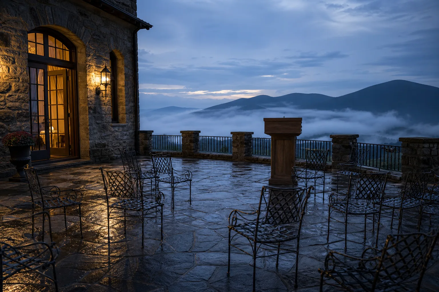 Empty stone terrace of a Blue Ridge mountain inn at dusk, chairs askew before a vacant lectern