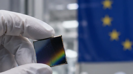 Compound-semiconductor wafers and photonic devices move through a cleanroom production line